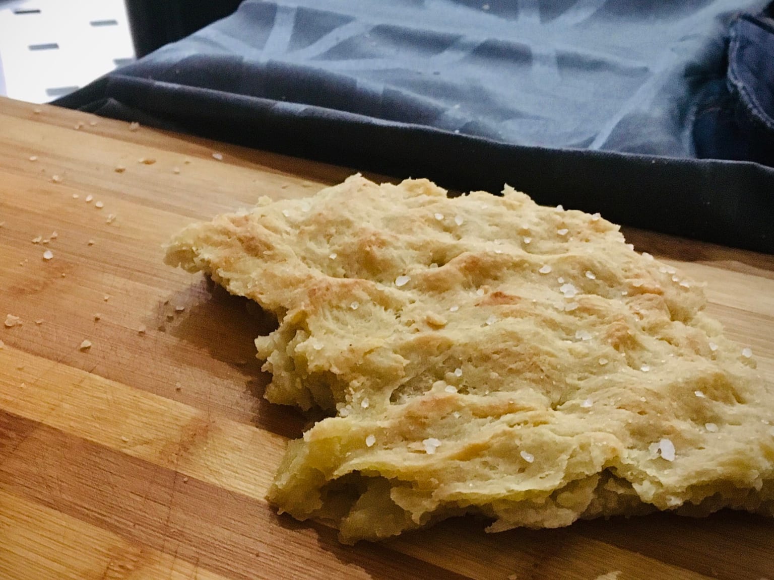 Focaccia Genovese served as a natural-light editorial food photograph