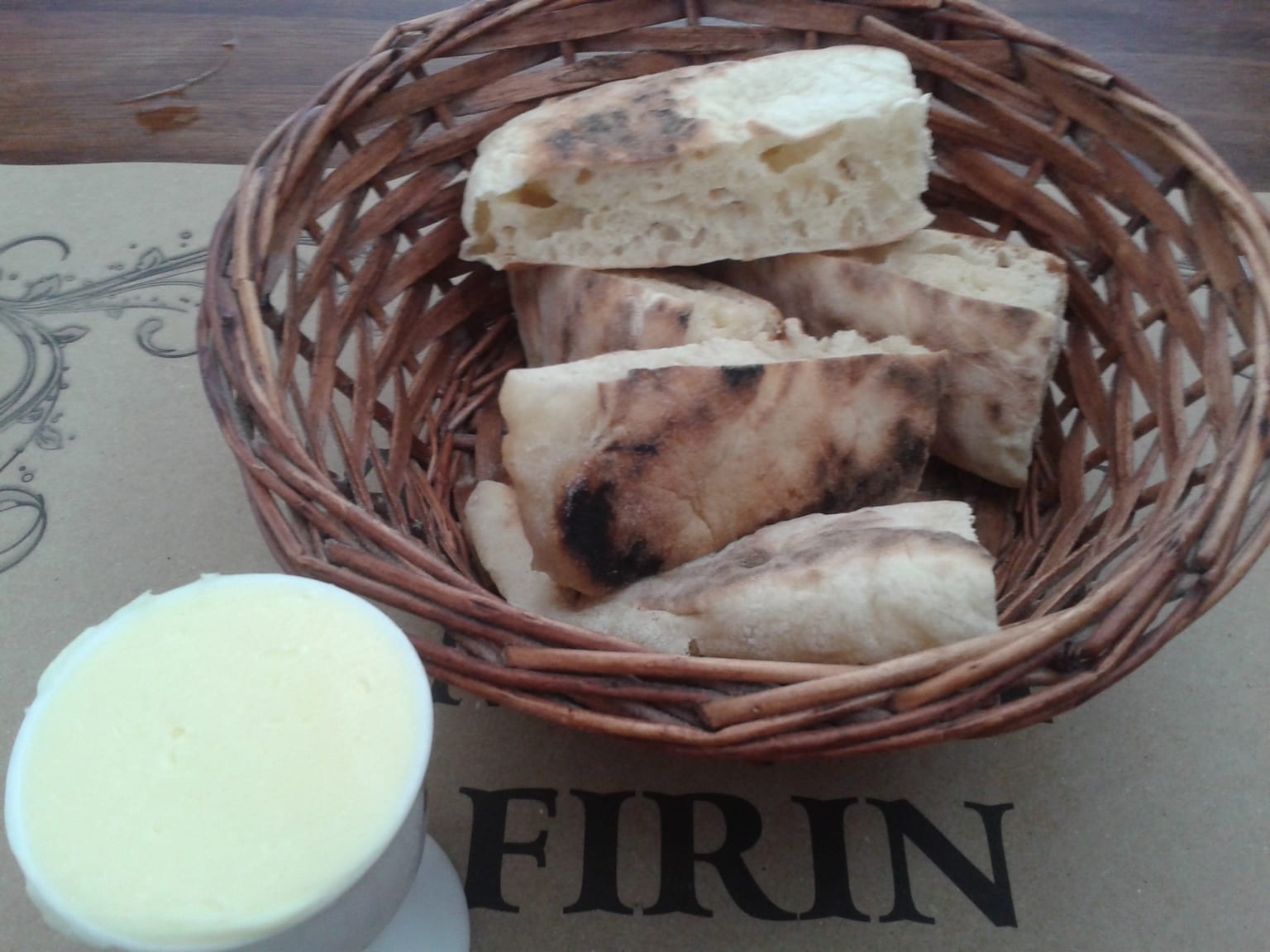 Bazlama: Turkish griddle bread served as a natural-light editorial food photograph